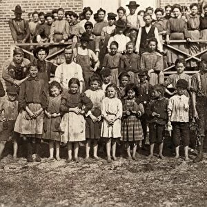 GEORGIA: TEXTILE MILL, 1909. Young children and adult textile workers in front