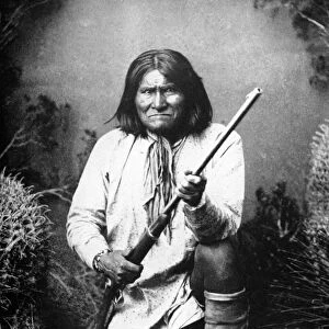 GERONIMO (1829-1909). American Apache leader. Photographed in 1887