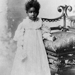 GIRL, 19th CENTURY. A late 19th century photograph of an African-American girl, exhibited by W
