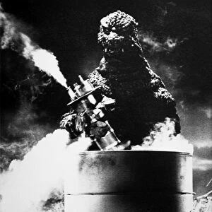 GODZILLA. Godzilla destroying an oil refinery in one of the Japanese Godzilla movies