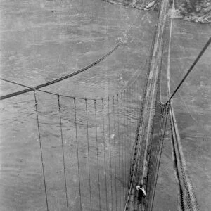 GRAND CANYON: BRIDGE, 1928. Rigger working on the Kaibab Trail Suspension Bridge