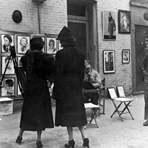 GREENWICH VILLAGE, c1950. Streetscene in Macdougal Alley of an outdoor art exhibit, c1950