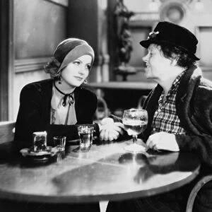 Greta Garbo and Marie Dressler (at right) in a scene from Anna Christie