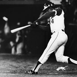 HANK aRON (1934- ). American baseball player. As a member of the Atlanta Braves, hitting his record-breaking 715th career home run off of pitcher Al Downing of the Los Angeles Dodgers, at Atlanta Stadium, Atlanta, Georgia, 8 April 1974
