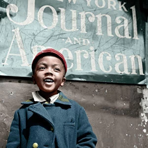 HARLEM NEWSBOY, 1943. A newsboy from Harlem, New York. Photograph by Gordon Parks, 1943