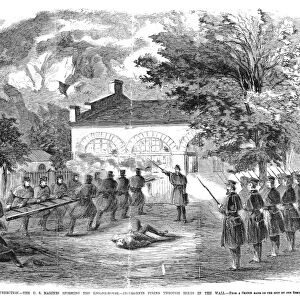 HARPERs FERRY, 1859. United States Marines under the command of Colonel Robert E. Lee smashing the armory door behind which insurgent leader John Brown and his men were trapped at Harpers Ferry, Virginia, 18 October 1859. Contemporary American wood engraving