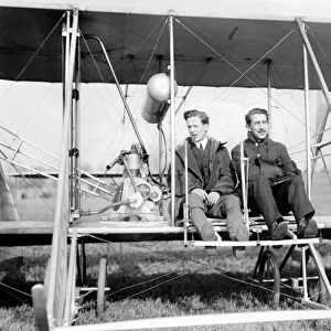 Harry Bingham Brown. American early aviator. Photographed seated in his airplane with a passenger on 14 July 1907