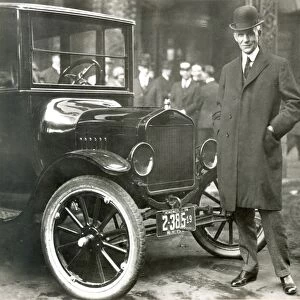 HENRY FORD (1863-1947). American automobile manufacturer. Photographed with one of his Model T automobiles, c1920