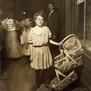 HINE: CHILD LABOR, 1908. Twelve-year old girl selling baskets on Market St. in Cincinnati, Ohio