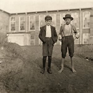 HINE: CHILD LABOR, 1908. Two young textile workers standing in front of the Wylie Mill in Chester