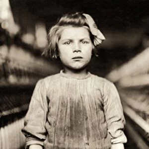 HINE: CHILD LABOR, 1909. A young spinner working in the Globe Cotton Mill in Augusta, Georgia