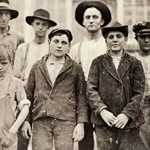 HINE: CHILD LABOR, 1909. Young textile mill workers with a supervisor at the Payne
