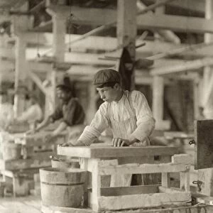 HINE: CHILD LABOR, 1910. A young boy polishing marble at the Vermont Marble Co