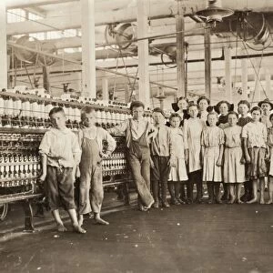 HINE: CHILD LABOR, 1911. A mill supervisor with a group of young workers all under