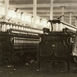 HINE: CHILD LABOR, 1911. A young spinner at the Washington Cotton Mills in Fries, Virginia