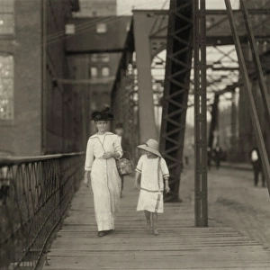 HINE: CHILD LABOR, 1913. A woman and a girl walking home from working at the Muscogee Mills