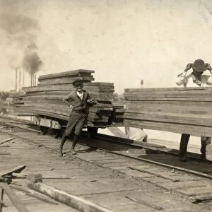 HINE: CHILD LABOR, 1913. Two young boys working at the Lutcher & Moore Lumber Co