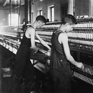 HINE: CHILD LABOR, 1916. Two boys spinning at the textile mill in Fall River, Massachusetts