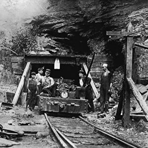 HINE: COAL MINERS, 1908. Entrance to a West Virginia coal mine. Photograph by Lewis Hine