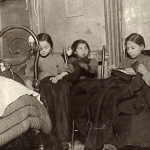 HINE: HOME INDUSTRY, 1910. Three young girls and a boy working on garments in a