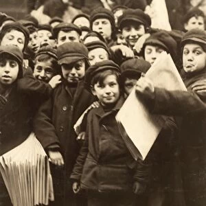 HINE: NEWSBOY, 1910. A group of newsboys in front of the paper office at Bank Alley in Syracuse