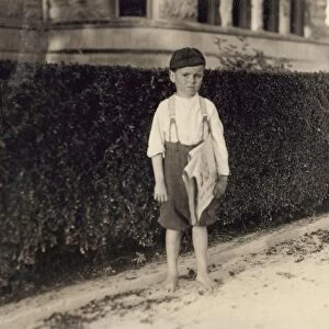 HINE: NEWSBOY, 1913. Six-year-old newsboy, Raymond Miller, at work in San Antonio, Texas