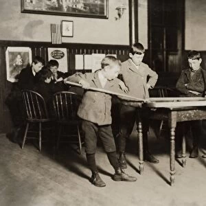 HINE: NEWSBOYS, 1909. Newsboy playing billiards at the United Workers Boys Club in New Haven