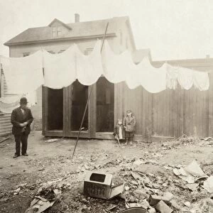 HINE: OUTHOUSES, 1912. Outhouses in the backyard on Borden Street in Providence, Rhode Island