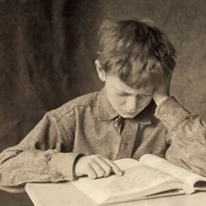 HINE: READING, c1924. A boy reading. Photograph by Lewis Wickes Hine, c1924