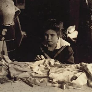 HINE: SEAMSTRESS, 1917. 16-year-old Helen Anderson sewing gowns for Madame Robinson in Boston