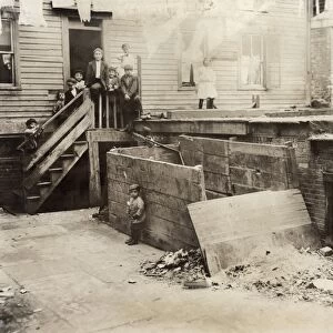 HINE: TENEMENT, 1912. Entrance to the house of a midwife in the rear tenement