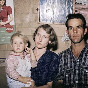 HOMESTEADERS, 1940. Homesteader Jack Whinery with his wife and youngest child in Pie Town