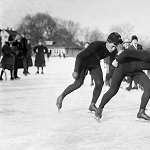 ICE SKATERS. Ice skaters Morris Wood and Peter Sinnerud skating alongside each