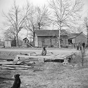 ILLINOIS: REBUILDING, 1937. A man rebuilding his home after it was destroyed in