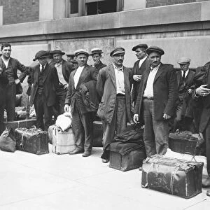 IMMIGRANTS: ELLIS ISLAND. A group of Italian immigrant men preparing to leave Ellis Island