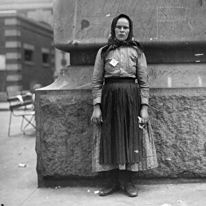 IMMIGRANTS: ELLIS ISLAND. An unidentified immigrant woman at Ellis Island, New York City