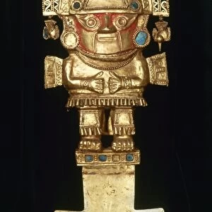 INCAN GOLD ORNAMENT. Incan spade-like gold ornament topped with a figure of a man in an elaborate headdress
