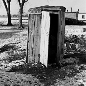 IOWA: OUTHOUSE, 1936. An outhouse in a shanty town in Spencer, Iowa. Photograph by Russell Lee