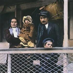 AN ITALIAN IMMIGRANT FAMILY on the Ellis Island ferry to Manhattan. Oil over a photograph