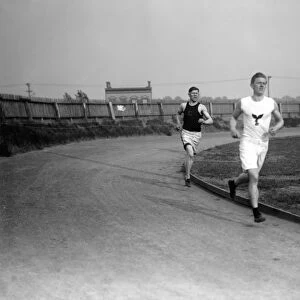 James Francis Thorpe. American athlete. Jim Thorpe (left) and Thomas McLaughlin (right) running on a track, 1910s