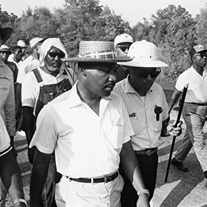 James Meredith (with cane) and Martin Luther King, Jr. during the Freedom March from Canton, Mississippi to the Tougaloo College campus, 25 June 1966