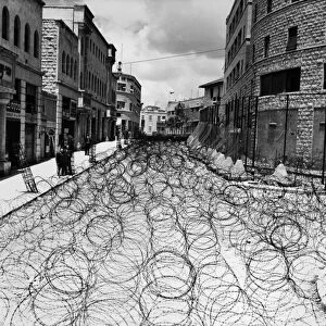 JERUSALEM: STREET, 1948. Princess Mary Avenue in Jerusalems Old City, filled with barbed wire to keep Arabs and Jews from interacting with each other, as the British Mandate of Palestine was terminated, May 1948