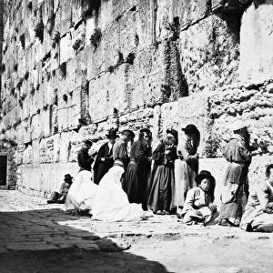 JERUSALEM: WAILING WALL. Jewish men and women at the Wailing Wall in Jerusalem