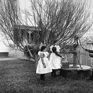 JOHNSTON: HAMPTON CHILDREN. Three children of Hampton, Virginia, playing with a
