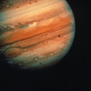 JUPITER, EUROPA, & IO. Voyager I photograph of Jupiter, Europa, and Io from 20 million miles