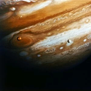 JUPITER. View of Jupiter and its moons Europa and Io from 12 million miles. Photographed from the Voyager 1, 13 February 1979