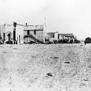 KANSAS: DODGE CITY, 1873. Front Street, Dodge City, looking east from Third Avenue