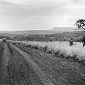 KENYA: HIGHWAY, 1936. Scene along a muddy highway in the Rift Valley in Kenya