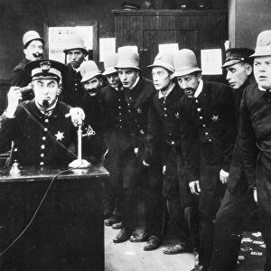 KEYSTONE KOPS. A scene from In the Clutches of a Gang, c1913. Fatty Arbuckle is at the extreme right