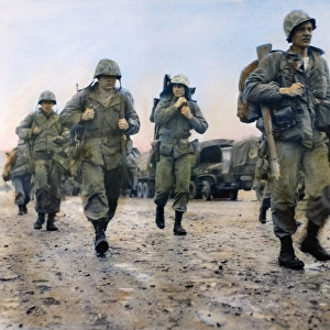 KOREAN WAR: MARINES, 1953. U. S. Marines in Korea heading for helicopters to take them to the front, March 1953. Oil over a photograph